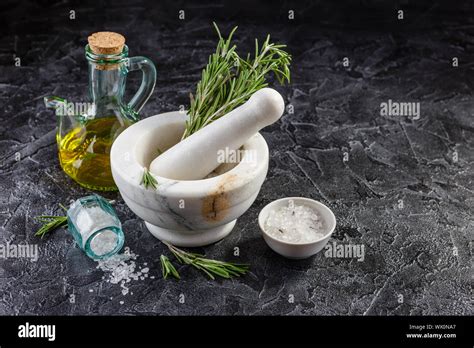 Herbs And Spices Mortar And Pestle Rosemary Olive Oil And Salt Stock