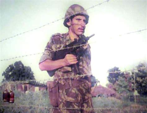 Portuguese Troop With His Uzi Checking The Alarm Systems On The Fence