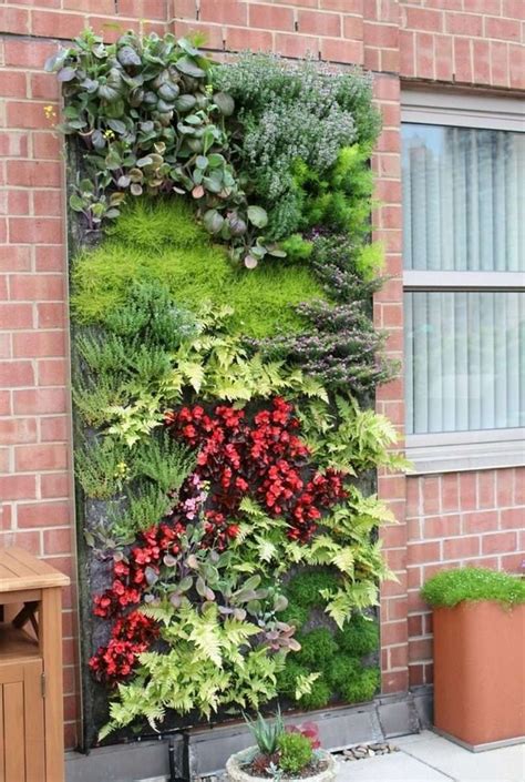 A Vertical Garden On The Side Of A Brick Building