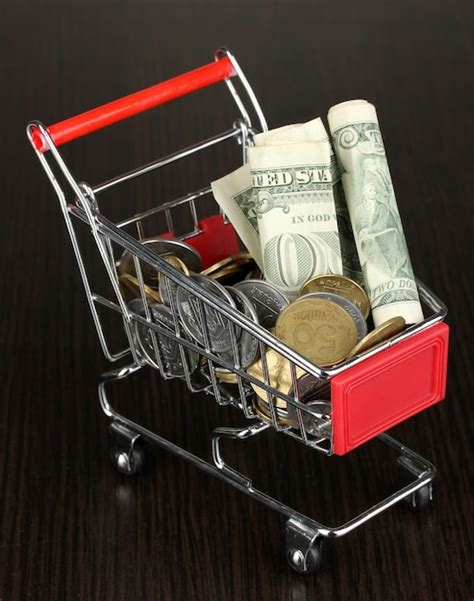 Premium Photo Money In Cart Isolated On Black