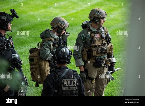 Members Of The Us Secret Service Uniformed Division Stand By For