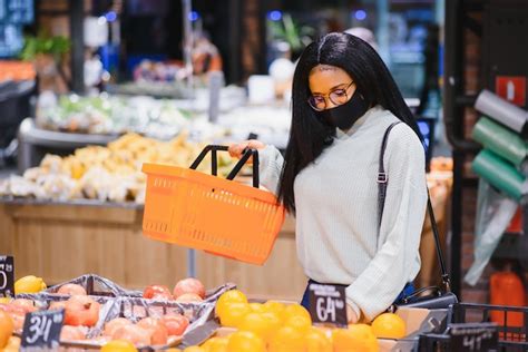 Premium Photo African Woman Wearing Disposable Medical Mask Shopping