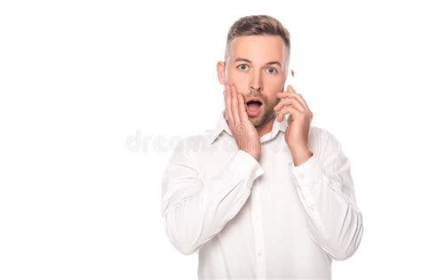 Shocked Businessman Talking On Smartphone Isolated On White Stock Image