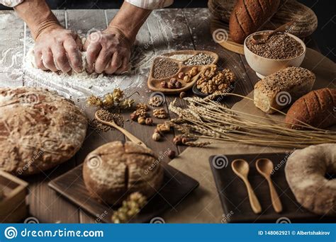 Close Up Of Baker Hands Kneading Dough And Making Bread With A Rolling