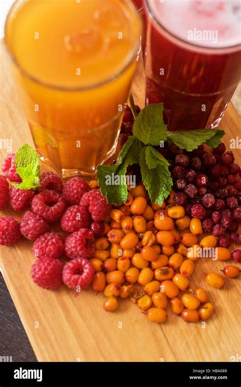 Fruit Drink With Cranberries Raspberries And Sea Buckthorn Stock Photo