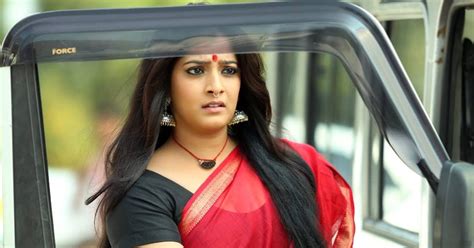 Varalaxmi Sarathkumar Hot Stills In Red Saree From Latest Malayalam