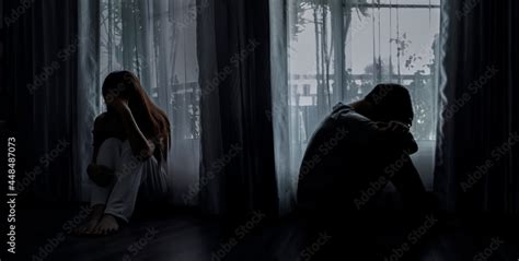 Sad Young Man And Woman Sitting On The Bed In The Bedroom People With