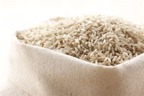 Brown rice in bag stock photo. Image of burlap, grain - 13401246