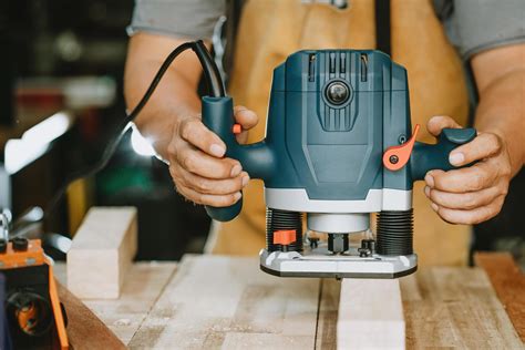 Carpenter Use Router Trimmer To Remove The Material And To Cut Out The