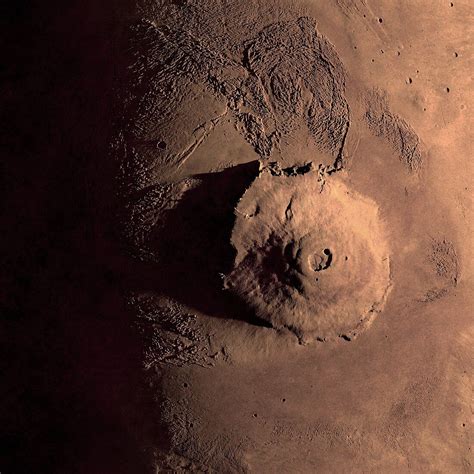 Olympus Mons is a large shield volcano on Mars. The volcano has a ...