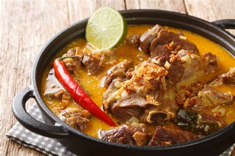 Gulai Kambing or Indonesian Traditional Delicious Goat Curry Closeup on the Pan. Horizontal ...