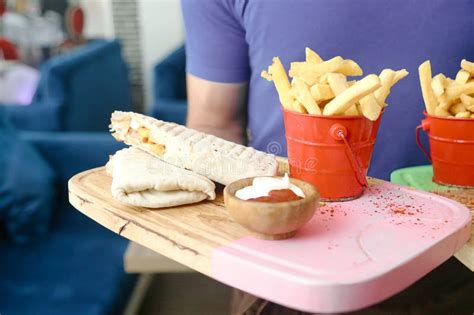 Person Holding Tray With French Fries And Sandwich Stock Photo Image