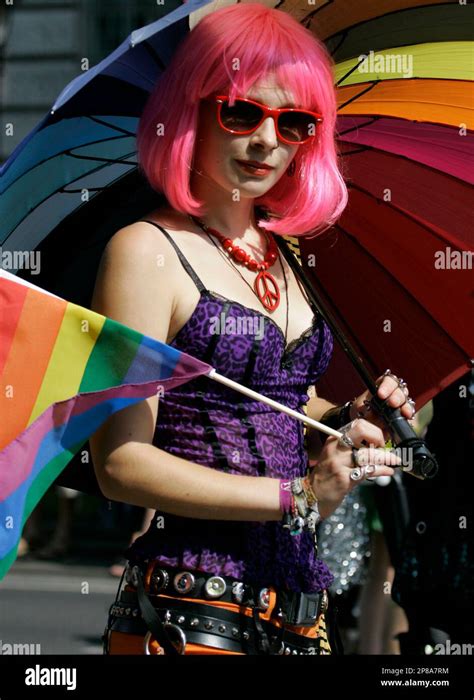 A Participant Of The Annual Gay Pride Rainbow Parade Poses In Downtown