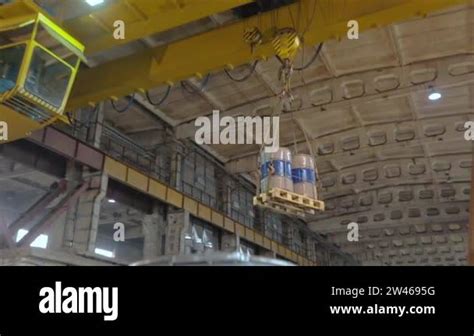 Overhead crane with load, overhead crane in operation, overhead crane ...