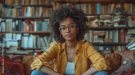 African American Woman Legs Crossed On Sofa Libary Of Books In The Background Created With