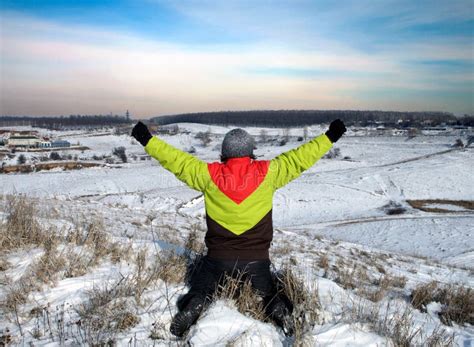 Man Sits In The Snow With His Hands Up Stock Photo Image Of