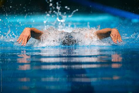 "Male Swimmer Racing Performing Butterfly Stroke" by Stocksy Contributor "Bratislav Nadezdic ...