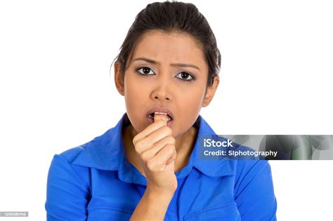 Portrait Of A Woman Sucking Thumb Biting Fingernail Feeling Clueless