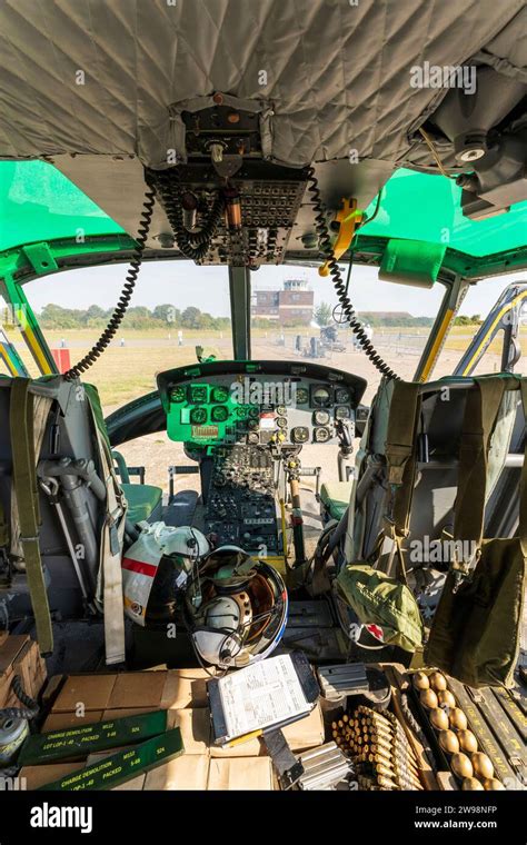 Interior, 1960's US decommission Bell Huey UH1 Iroquois Helicopter. Pilot and co-pilot's seat ...