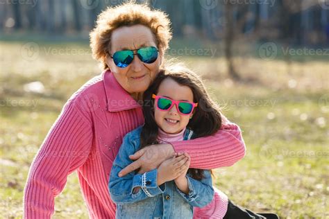 Happy Grandmother And Granddaughter In The Park 17462787 Stock Photo At