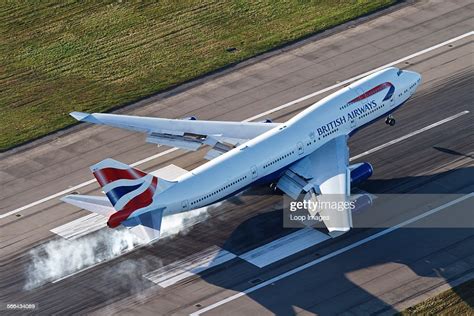 Aerial View Of A British Airways Boeing 747 Landing On Runway 27r At