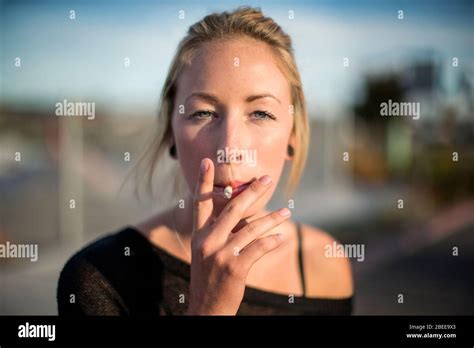 Portrait Of Blonde Woman Smoking Stock Photo Alamy
