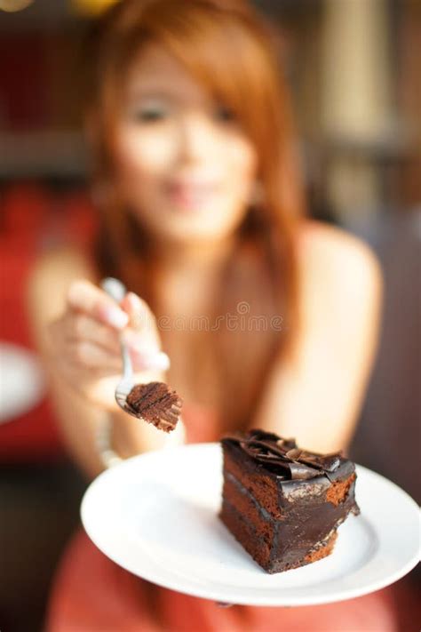 Young Beautiful Woman Sitting In Cafe Eating Chocolate Cake Stock Image