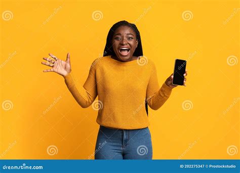 Wow Surprised African Woman Holding Smartphone With Black Screen