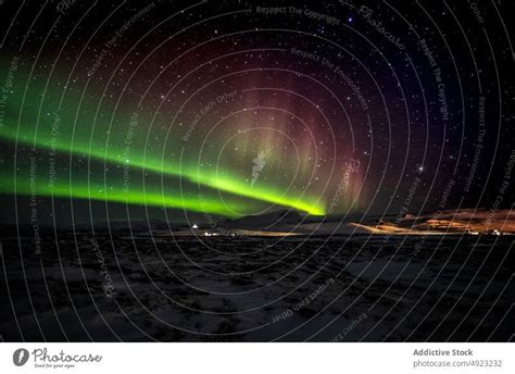 Scenic Northern Lights At Night In Mountainous Terrain A Royalty Free