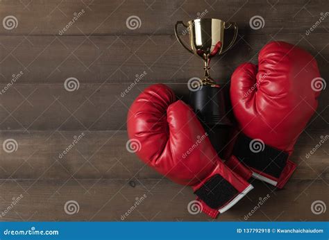Red Boxing Glove And Trophy On Wood Bcakground Stock Photo Image Of
