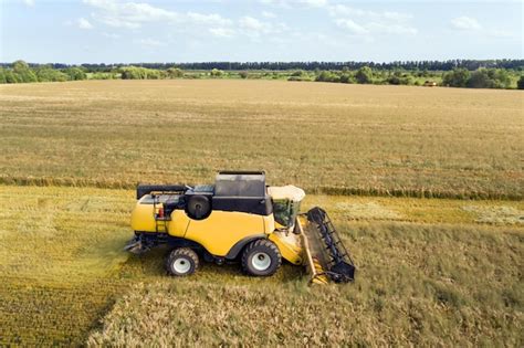 Premium Photo Aerial View Of Combine Harvester Harvesting Large Ripe