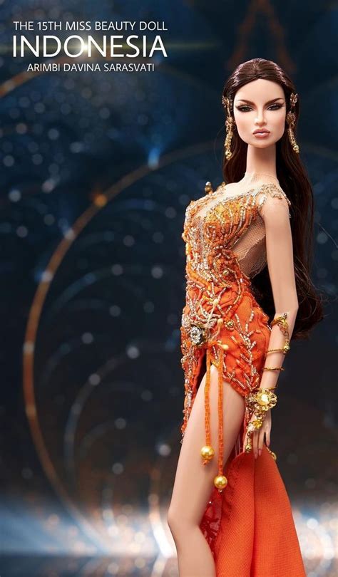 A Barbie Doll Is Dressed In An Orange Dress And Headpiece With Gold