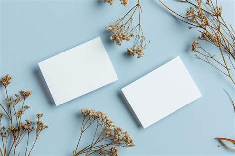 Premium Photo Two Blank Cards And Dried Flowers On Table