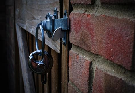 Premium Photo Close Up Of Padlock Hanging On Door