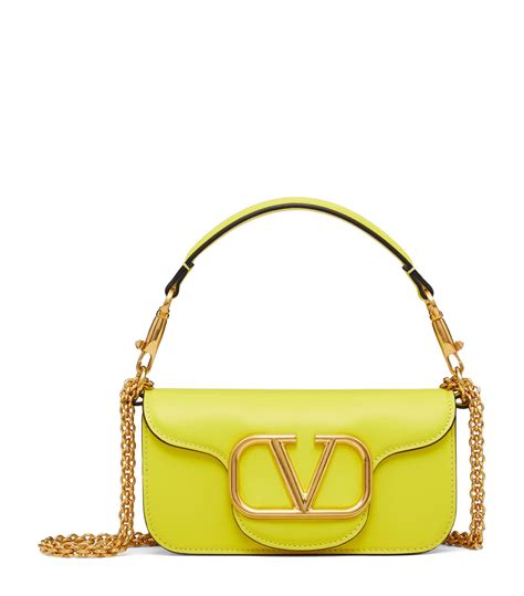 Womens Valentino Garavani yellow Leather Locó Top Handle Bag Harrods US