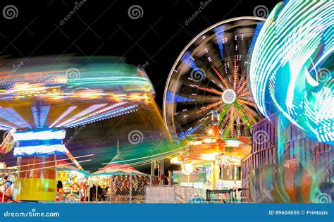 Carnival And Ferris Wheel At Night Spinning Lights Stock Image Image