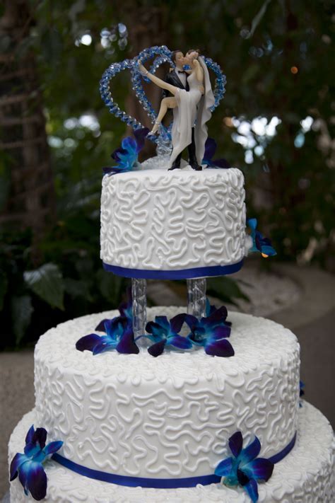 Top Tier Of A Royal Blue Wedding Cake Decorated With White Chocolate Butter Cream Satin I