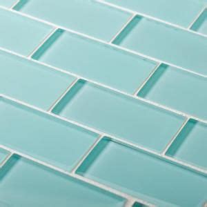 A Close Up View Of A Blue Glass Tile Wall