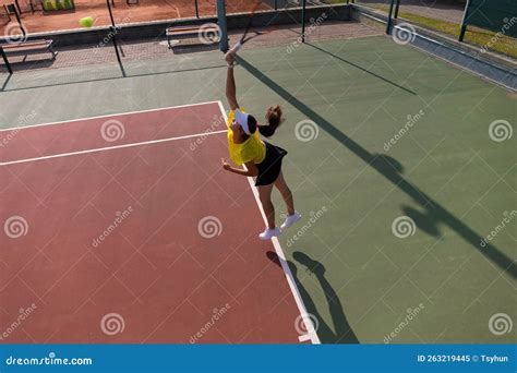 Professional Equipped Female Tennis Player Beating Hard The Tennis Ball