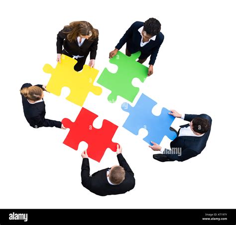 Businesspeople Solving Jigsaw Puzzle Stock Photo Alamy