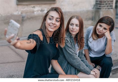 Стоковая фотография 489210418 Three Girls Sitting Streets Stairs