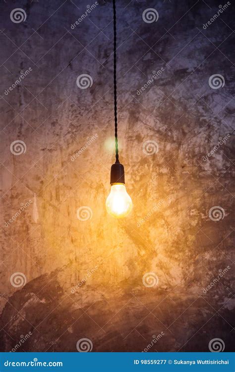 Light Bulb Hanging From Ceiling With Illumination Stock Image Image