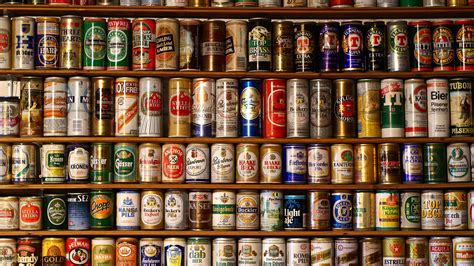 A wall of different brands of beer cans