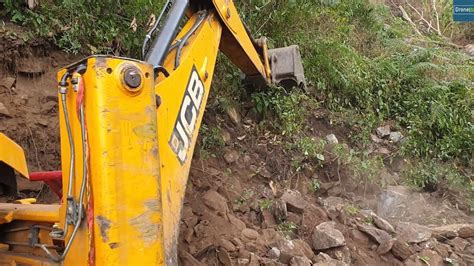 Hill With Boulders JCB Backhoe Loader Cutting And Making New Hilly