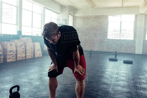 Muscular Man Looking Exhausted And Resting After Hard Training Resting