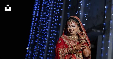 A Woman In A Red And Gold Wedding Outfit Photo Free Uttar Pradesh Image On Unsplash