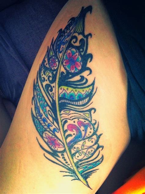 Vivid Colored Tribal Feather Tattoo On Thigh Tattooimages Biz