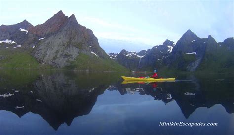 Kayaking a craft in the fjords of Reine, Lofoten Islands - Minikin ...