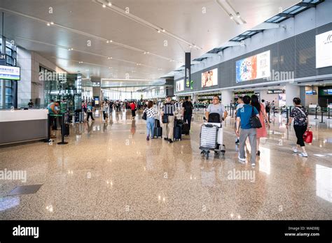 Passengers walk at the Terminal 2, Shanghai Hongqiao International ...