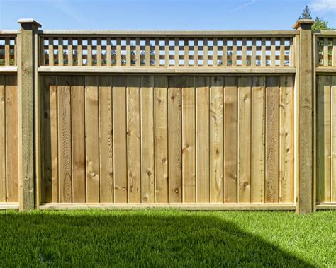 We Love Beautiful Cedar Fence Designs This One Mixed With Panels And Lattice Work Is Subtle Yet